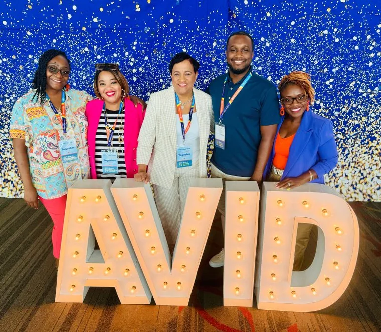 Dr. Martha Liddell with the AVID team at a conference.